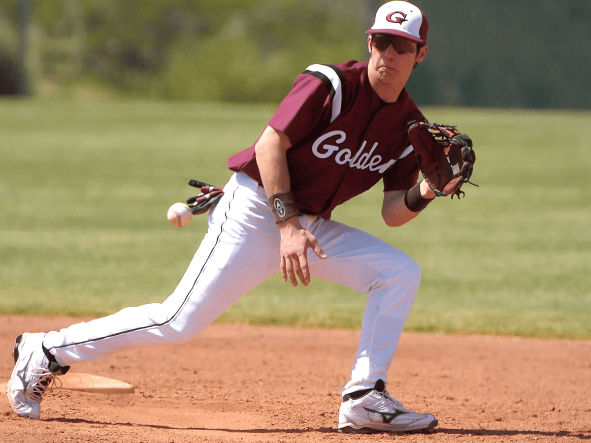 baseball player fielding ball