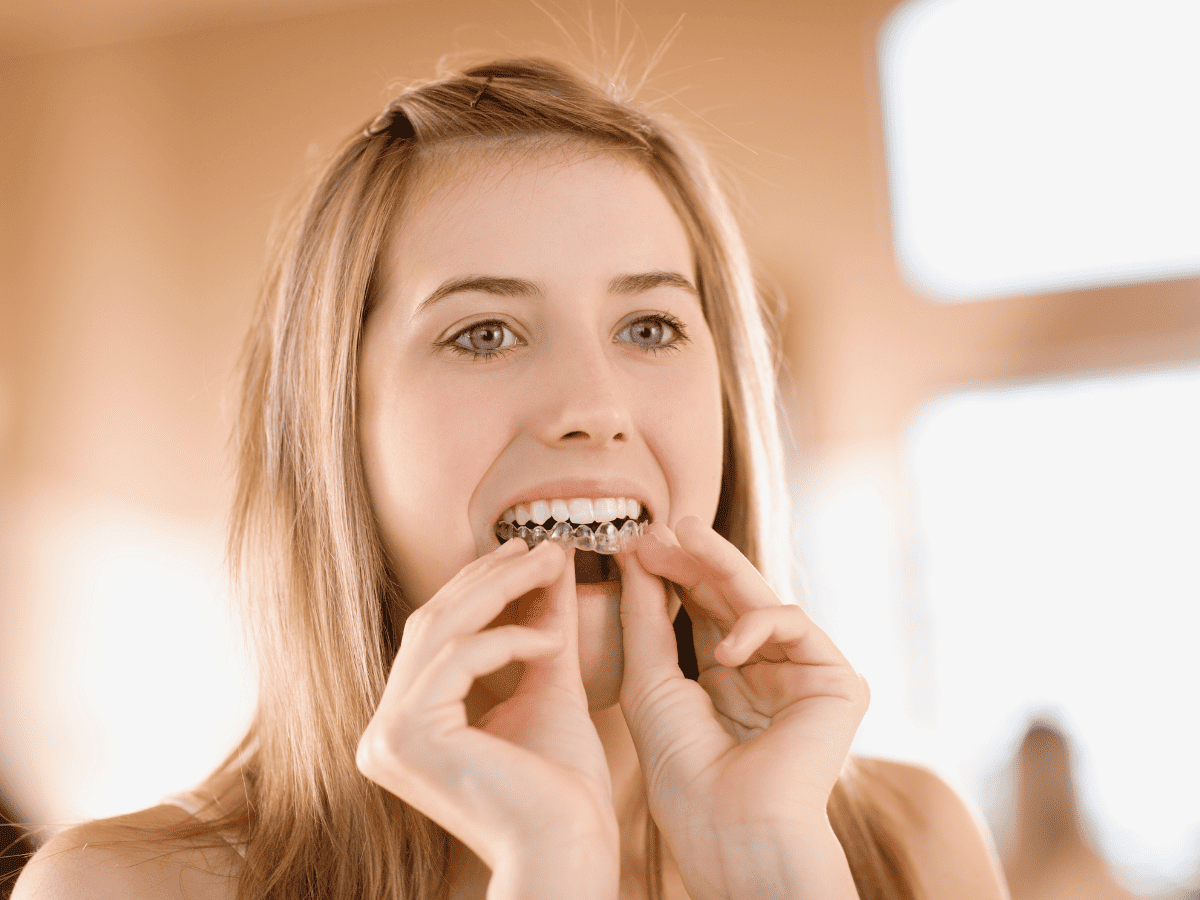 teenager whitening teeth