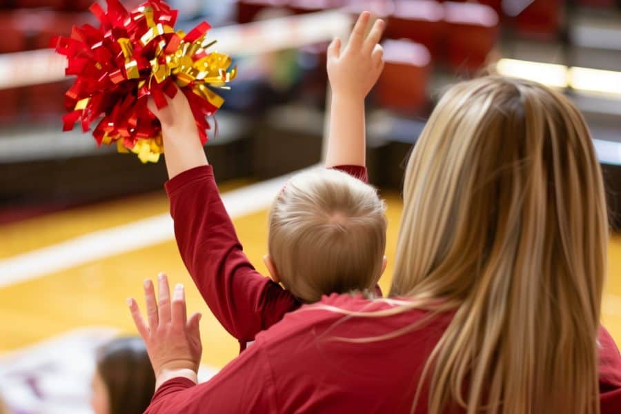 volleyball fans cheering from the sidelines