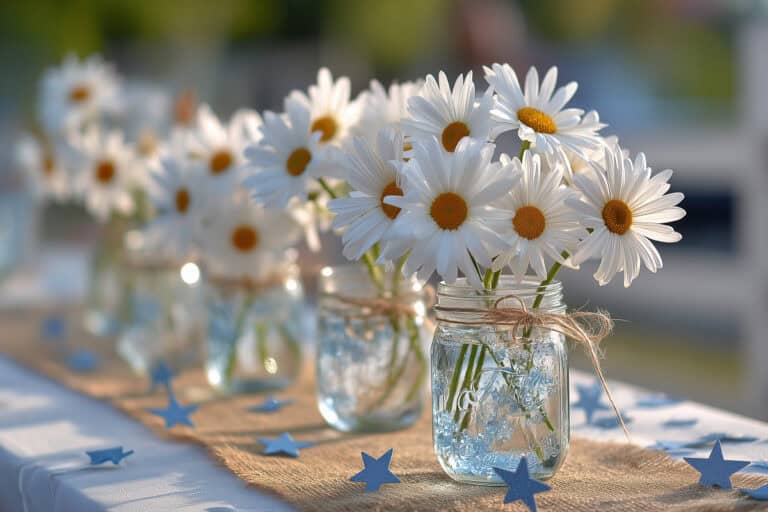 Vase of daisies arranged in glass jars on outdoor table with star-shaped decorations, celebrating spring or summer wellness, fitness, and joyful lifestyle for women over 40.