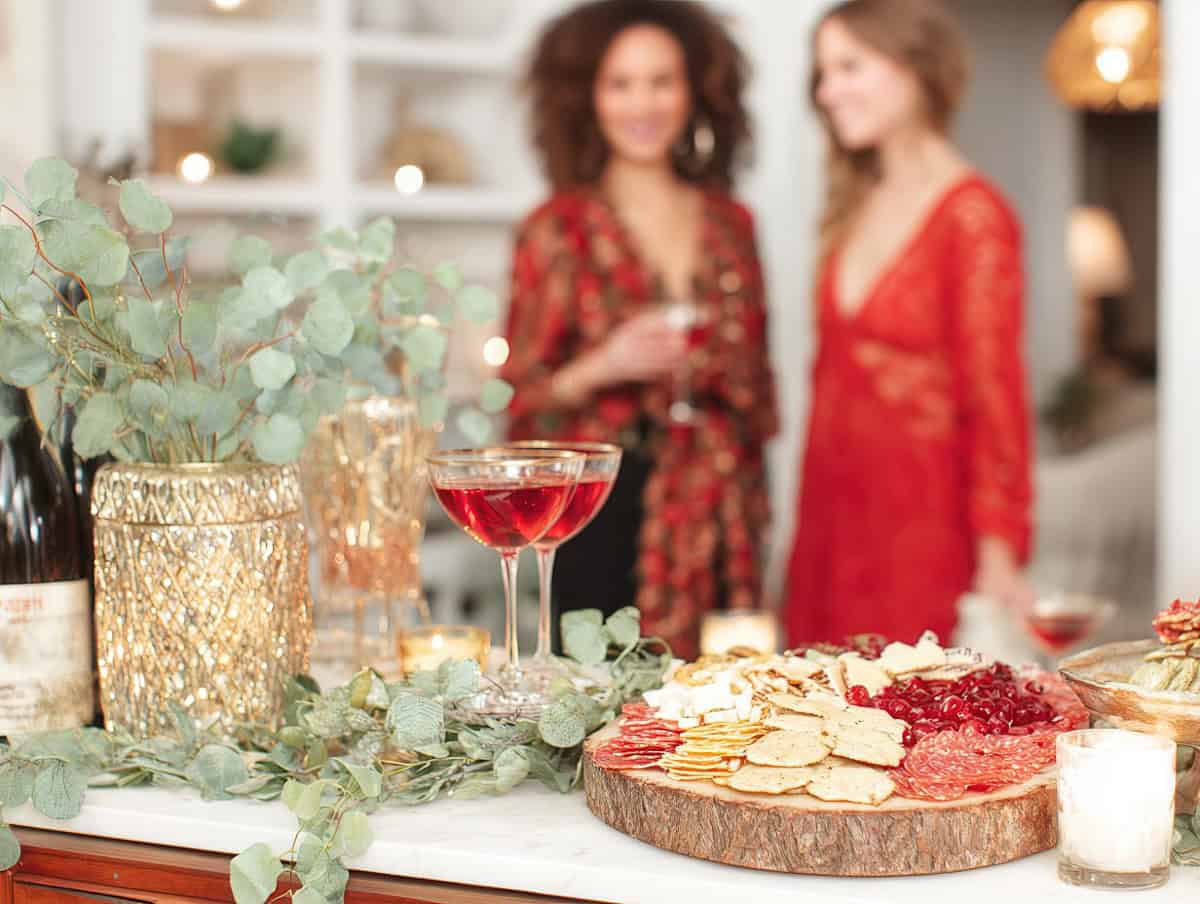 Friends mingling at a tinsel tini party